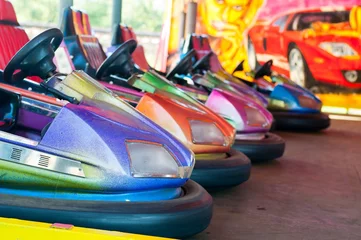 Deurstickers Colorful electric bumper car in autodrom in the fairground attractions at amusement park. Selective focus on the cars © kviktor