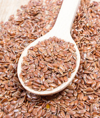 closeup of flaxseed on wood background
