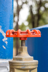 red valve on-off water in close up
