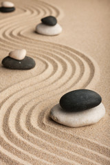  Pyramid  made of  stones standing on the sand