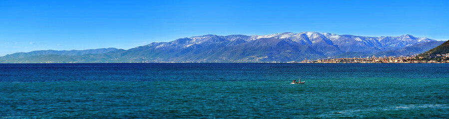 great panoramic view of snowly mountain and city