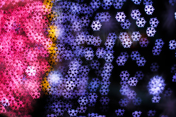 Blurring lights bokeh background of snowflakes