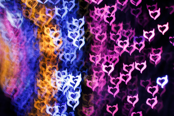Blurring lights bokeh background of Devil hearts