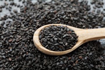 Spoon full of black sesame seeds