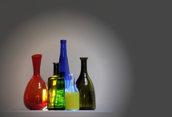 Vintage multicolor group of bottles in a row.