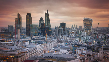 Fototapeta na wymiar LONDON, UK - JANUARY 27, 2015: City of London at sunset, business and banking aria aerial view