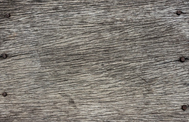 Old wooden background with rusty nails