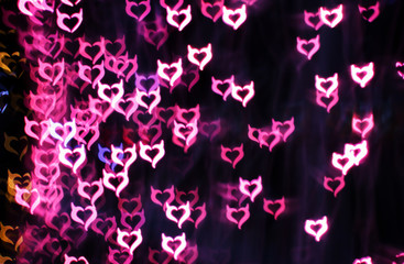 Blurring lights bokeh background of Devil hearts