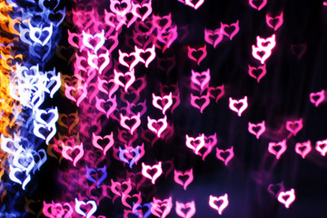 Blurring lights bokeh background of Devil hearts