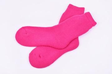 Wool knitted socks on white background