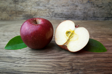 Red apples on a wooden table