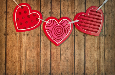Three Valentine's Hearts on a Wood Plank Background