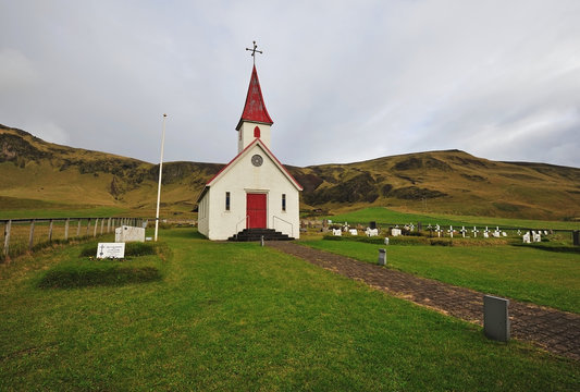 Old red wooden Lutheran church near Vik beach, Reynisfjara, Iceland