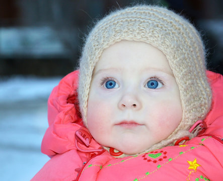 10 month old baby in winter clothes, close-up