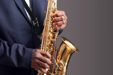 African American jazz musician playing the saxophone, closeup