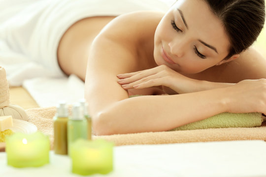 Spa concept. Young pretty woman relaxing, close up