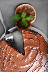 Chocolate pie with fork and ingredients on table