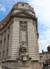 Fototapeta na wymiar London, Admiralty Arch, seen from The Mall. Sir Thomas Brock's figure of Navigation