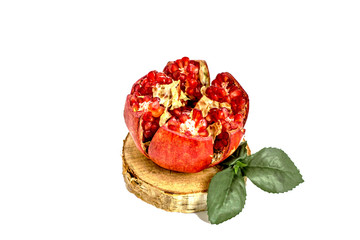 pomegranate fruit on a wooden isolated on white