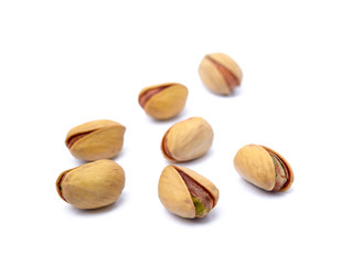 Pile of fresh pistachios isolated on white background