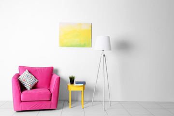 Living room interior with pink armchair, lamp and yellow chair  on white wall background