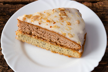 cake on a white plate on a wooden background