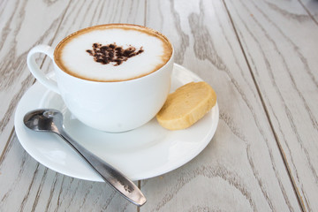  cappuccino coffee cup on wood table at coffee shop