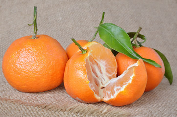 Fresh, ripe citrus, on a rough sacking