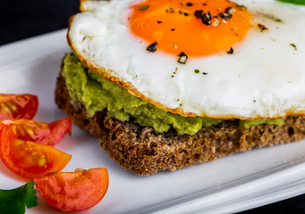 Sandwich with avocado paste and egg