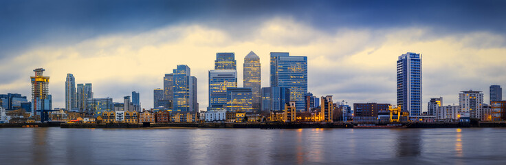 Panoramic skyline of Canary Wharf, the worlds leading financial district at blue hour - London, UK