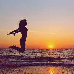 Fototapeta na wymiar woman at sunset