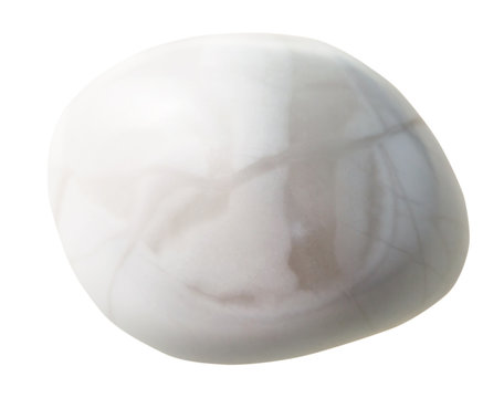 tumbled Magnesite gem stone isolated on white