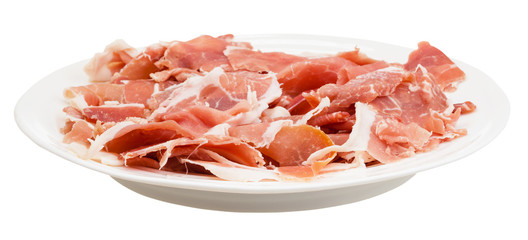 side view of thin sliced dry-cured ham on plate
