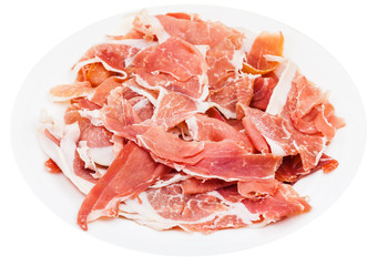 thin sliced uncooked jerked pork on plate isolated