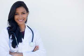 Closeup portrait of friendly, smiling confident female doctor arms hands crossed folded, healthcare professional isolated white background. Positive human face expression, emotion attitude
