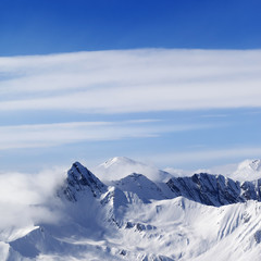 Fototapeta na wymiar Snowy mountains in haze