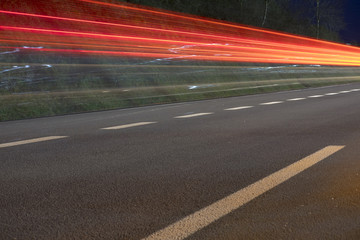 Car lights on road at night