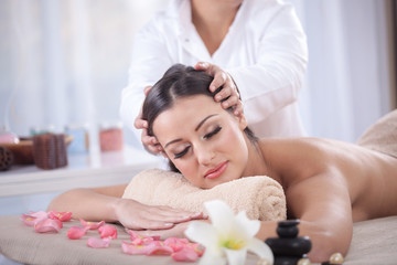 Obraz na płótnie Canvas Masseur doing massage on woman body in the spa salon