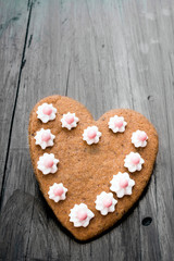 Heart shaped cookies on dark wooden background