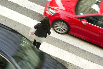 woman  in dangerous situation in crosswalk  with traffic lights in street city