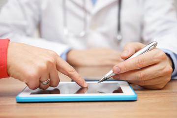 doctor is showing digital prescription for medicine on tablet pc