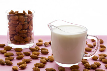 Almond milk with almond on a  table, lactose free