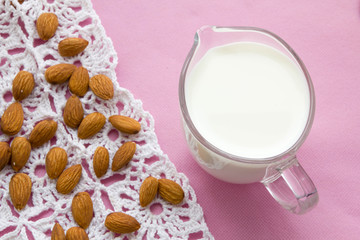 Fototapeta na wymiar Almond milk with almond on a table, lactose free