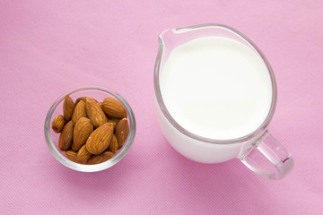 Almond milk with almond on a  table, lactose free