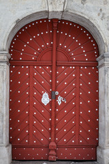 Beautiful old red wooden door in castle