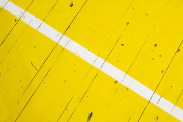 white stripe on yellow floor