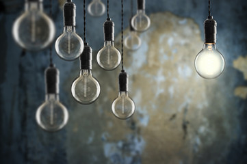 Fototapety  Idea and leadership concept Vintage  bulbs on wall background