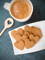 Cup of coffee and heart shaped cookies