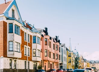 Foto op Plexiglas street of coloured houses on a Sunny day in Helsinki © stasknop