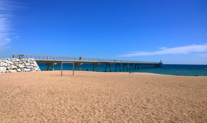 View of Badalona beach and Pont del Petroli (a place for walking over the sea), Spain